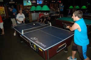 Bruce Bogese (left) competes against Dylan Hornstein (right) in Sunday's Ping Pong Tournament. (Photo by Hannah Davis)