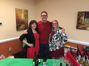 Chamber Executive Director Joy Stump, left, poses with daughter Danielle and son-in-law Brandon Hennessey.