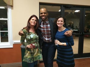 Rachel Talent-Ivers, left, Justin Reid and Emily Grabiec greet one another.