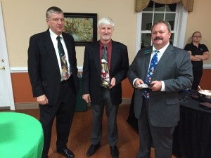 Farmville Mayor David Whitus, left, Prince Edward County Administrator Wade Bartlett, middle, and Kirby Moore display their colorful Christmas ties.