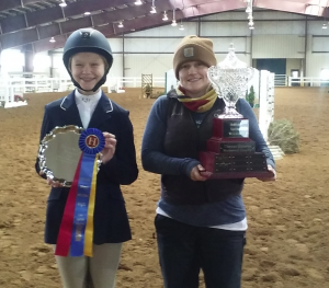 Kaylee Scohdt, left, and trainer Holly C. Welter show off their trophies and ribbons that they won at the Hollins Spring Welcome competition hosted in Lexington over the weekend.