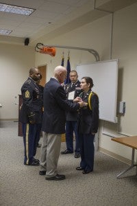 CARSON REEHER | HERALD Brigadier General Edwin Kelley Jr. presents Cadet Lieutenant Brittny Price with the Legion of Valor Bronze Cross for Achievement, as LTC William Carter, the JROTC senior army instructor, looks on.