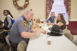 CARSON REEHER | HERALD Local law enforcement enjoy the breakfast provided for them at Cedar Baptist Church. 