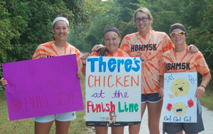 TITUS MOHLER | HERALD From left, Emily Murphy, Kaylynn Batten, Jessica Eaton and Krista Kelly, all of Farmville, cheer on runners. They volunteered to help out at the event.