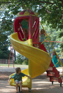 CARSON REEHER | HERALD Sunrise Learning Center students play on playground equipment at Grove Street Park during their outside time one morning.