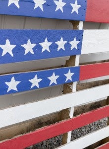 CARSON REEHER | HERALD It took three days to paint over this wood pallet to make it look like a flag.