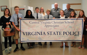 Students show their appreciation for Virginia State Police (VSP) troopers at VSP’s regional headquarters in Buckingham County. Pictured are, from left Amelia Irausquin, Chad Jones, Amearah Hopkins, Addison Heslip, Skylar Davis, Caleb Walter, Emmaline Michaels, Ivy Logan and Julianna Crawford with Trooper Jake Woolford and Sgt. John Madding.