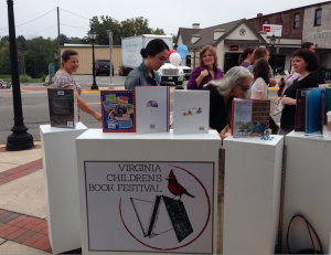 The mobile book cart, funded by Farmville Downtown Partnership’s new SOUP grant, features the VCBF logo.