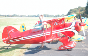 TITUS MOHLER | HERALD Eric Sandifer, of Cary, N.C., watches a pilot’s flying while readying the aircraft in front of him.