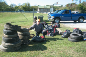 Sam Martin Jr., of the Friends of the Appomattox River (FAR), looks over some of the trash picked up during FARs Oct. 15 cleanup event.