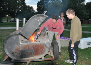 JORDAN MILES | HERALD Enrique Elizondo, left, and Spencer Dixon ready the grill for the oyster roast.