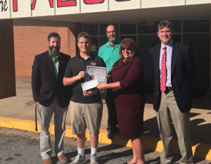 Fuqua School student Jeffrey Fariss, second from left, is one of 17 winners of the Virginia Farm Bureau Federation’s agriculture essay contest. Here, he receives his award certificate from Farm Bureau Agent Karen Newman as, from left, Fuqua Upper School Head Alex Haggard, AIT Instructor Carol Gillepsie and Head of School John Melton look on.