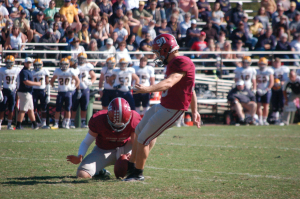 TITUS MOHLER | HERALD Hampden-Sydney College senior kicker/punter Jordan Chalkley, No. 90 at right, kicks the ball in search of points, but he also was responsible for punts, and the conference recognized his key ability in those circumstances. He averaged a league-high 42.8 yards per punt and launched a 63-yarder in a game on Oct. 29.