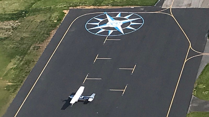 New compass rose painted at airport - Farmville | Farmville